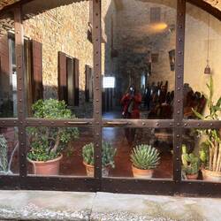 Sloped floor inside for water catchment - archway overlooking the courtyard