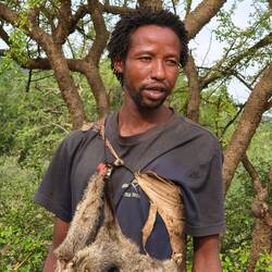 He was scolded when he tried to eat the head because it's reserved for the shooter.