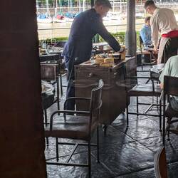 This guy brought a cheese cart around to sell people pieces of Argentinian cheese