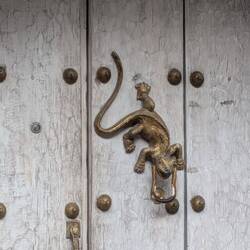 The door knockers have meaning. This one means mins live here