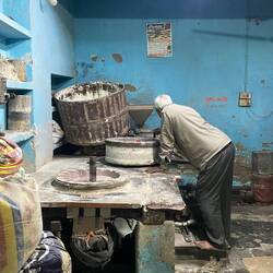 He's making flour with stones!!!