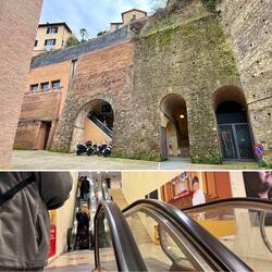 Über Rolltreppen geht bequem hoch zur Stadt.