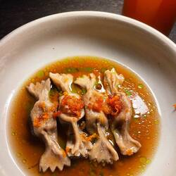 Porcini pasta filled with chestnut mushroom filling. Orange zest, bacon?, leek broth. Very subtle