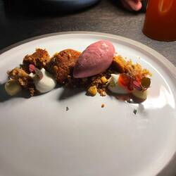 Cranberry ice cream with sticky toffee cake, yuzu cream, whipped cream