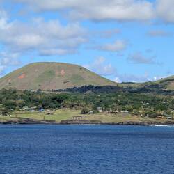 Easter Island from the ship, you can already see some of the famous statues (moai) at the beach