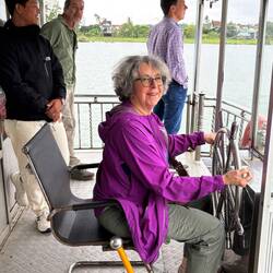 Taking a turn steering the boat