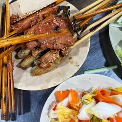Dinner: pork skewers with Kim chi, vegetables and rice paper,
