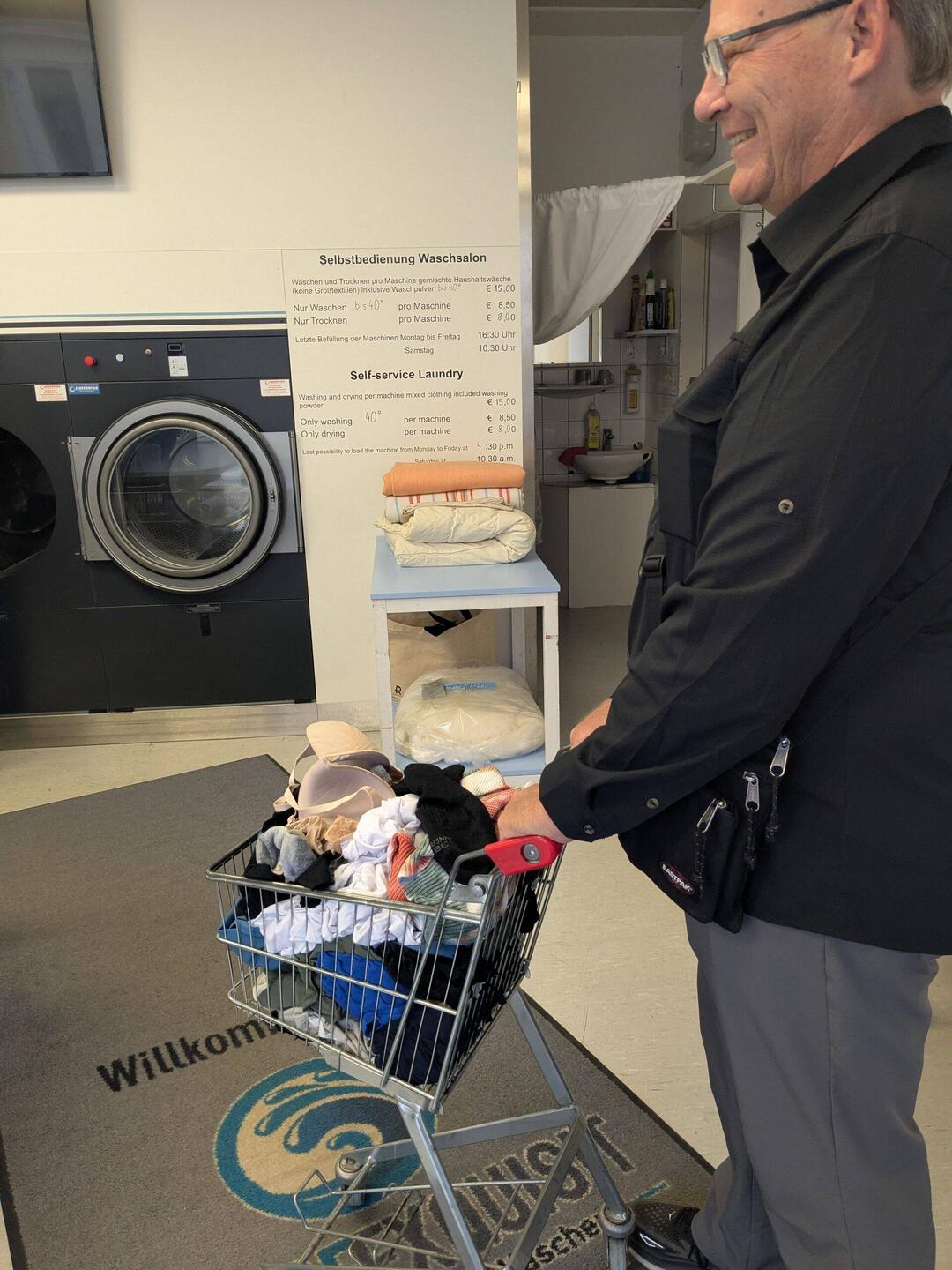 Wheeling the clean clothes over to the dryer. Fun times!
