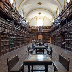 The bottom shelves were placed on benches that ran along 2 sides of the room.