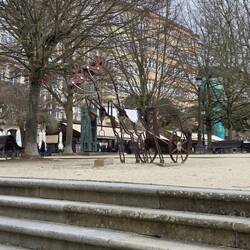 A horse and chariot scupture.