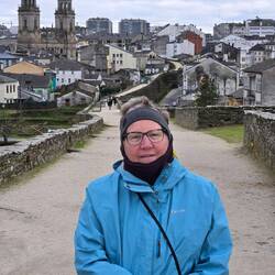 On top of the wall. You can still see the cathedral behind me.
