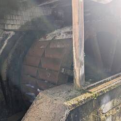 Water wheel, used to crush grain but similar ones helped flush the streets.