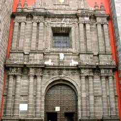 Outside of the grey Santo Domingo church