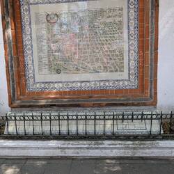 Old city map on a wall.