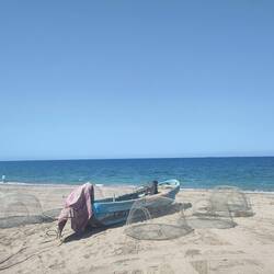 At the beach. Fishermen come in and out to catch crabs