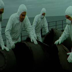 Investigating the wreckage brought onboard