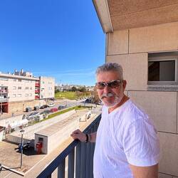 Getting some fresh air on the balcony at the end of the corridor