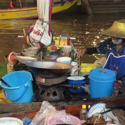 A beautiful woman, in amazing golden hat, whipped up our tea from her gently bobbing boat.