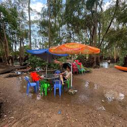 Quick stop for a drink with our toes in the sandy pools of the Mekong 💖