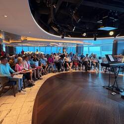 SING OUR LOUD- Paul, a musical director, conducting