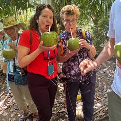 Francie and Mary enjoying fresh coconut milk