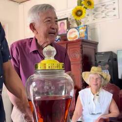 Henry's dad with his homemade banana whiskey