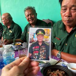 These 3 retired Viet Cong officers spoke with us; middle man showed his highly-decorated uniform