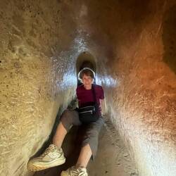 Jane sliding through 100' tunnel