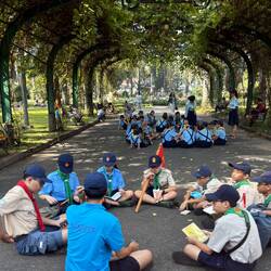 Scouts in a public park; scouting is mandatory. They gather on Sundays