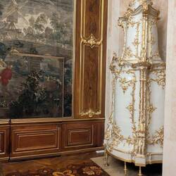 Porcelain heater in the corner with incredible parquet floors.