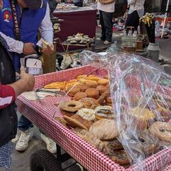 A Panadero (breadman) selling bread with very funny music playing by Tintan. https://share.google/dC