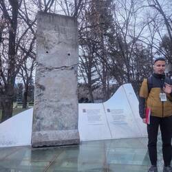 Piece of the Berlin Wall and our guide