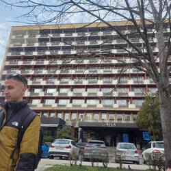Communist walking tour, beginning at the brutalist building of the communist era