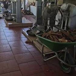 Coconut candy factory on the Mekong Delta River - process of cutting, melting & shaping coconut