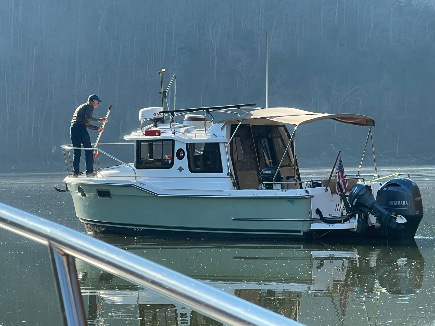 Bill cleaning his anchor as he brings it up.