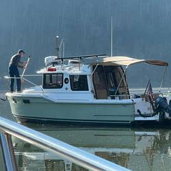 Bill cleaning his anchor as he brings it up.