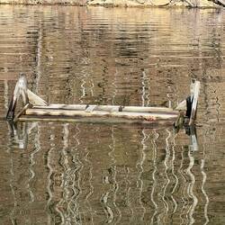 Double swinging chair. It's upside down in the water.