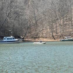 Anchored in Jackson Hollow. Bill rowing his Kaboat.