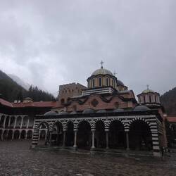Rila Monastery with snowcapped mountains in the background