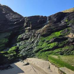 A little waterfall trickling down to the beach.