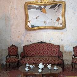 Bullet holes in the mirror and on the walls