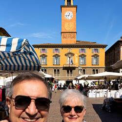 Piazza Prampolini and the clock tower at Palazzo Monte di Pietá — Reggio Emilia, Italy.