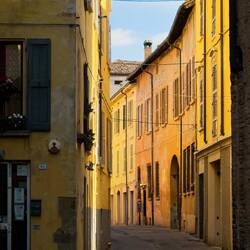 Colorful side street in the historic center — Reggio Emilia, Italy.