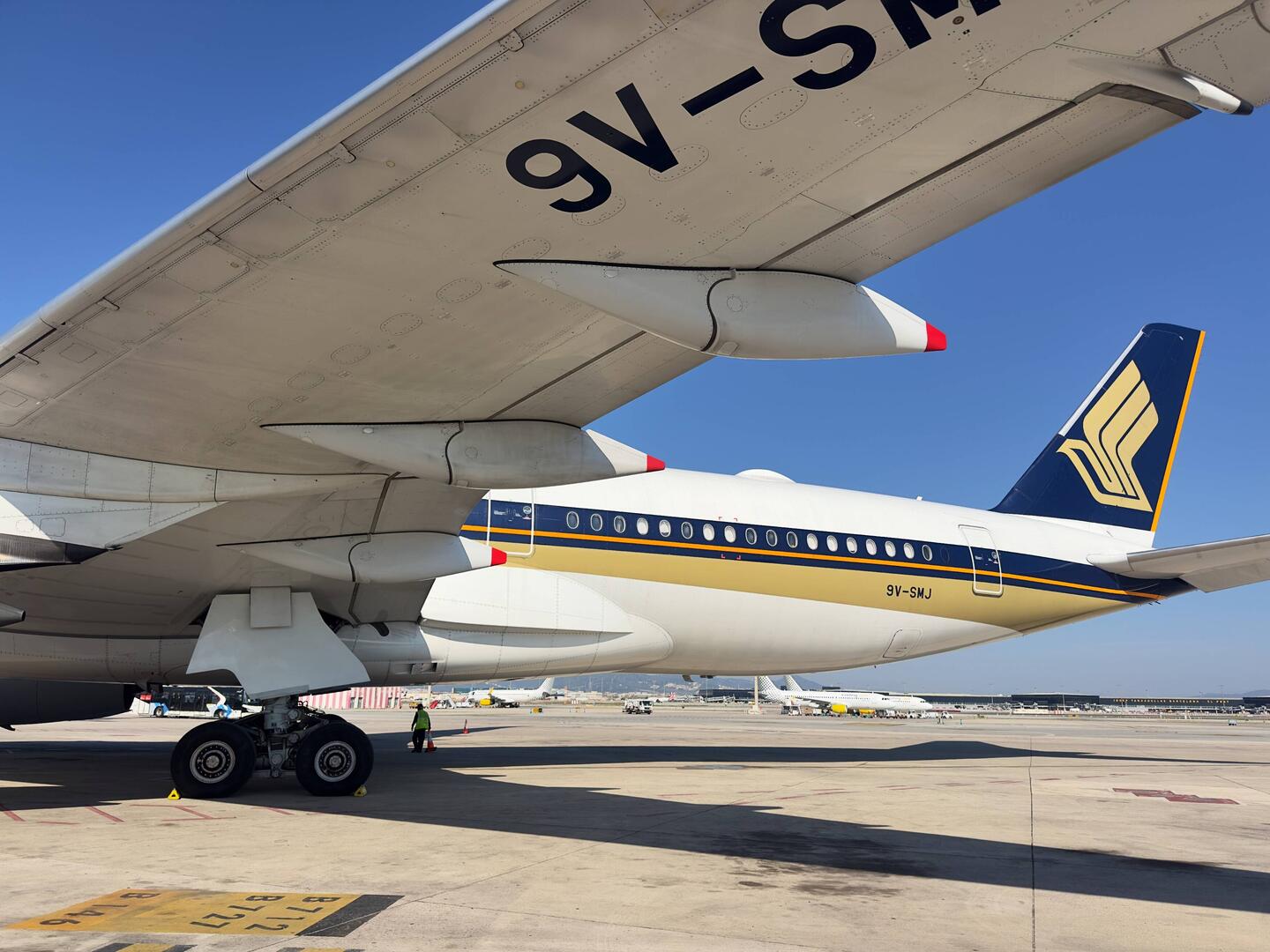 9V-SMJ at the remote bay at BCN waiting to operate as SQ377 to MXP and onwards to SIN.