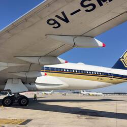 9V-SMJ at the remote bay at BCN waiting to operate as SQ377 to MXP and onwards to SIN.