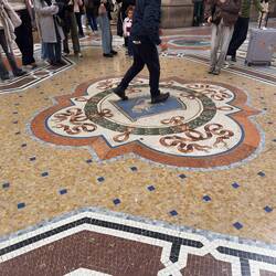 The dancing bull mosaic at Galleria Vittorio Emanuele II.