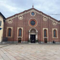 The front facade of the Santa Maria delle Grazie is done in Lombardy Gothic style.