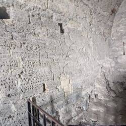 Medieval graffiti on the walls in one of the dungeons.