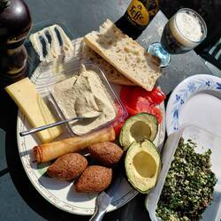 Lunch with hummus and kibble from the marche stall. Tabouleh from chef Roger (and our herb garden)