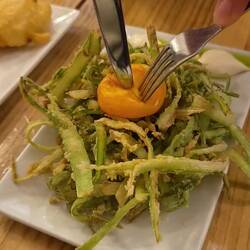 Shaved asparagus, fried and served with an egg